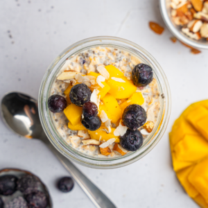 Top down view of the high protein overnight oats with berries and fruit.