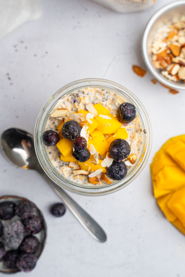 Top down view of the high protein overnight oats with berries and fruit.