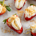 Deviled strawberries topped with graham cracker crumbs.