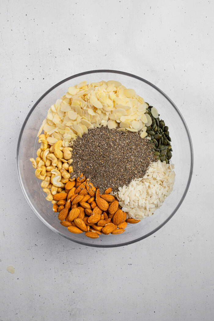 Nuts and seeds and coconut in a large mixing bowl.