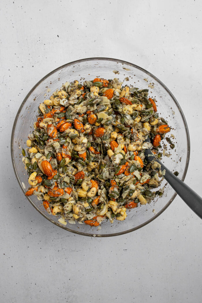 A mixture including wet ingredients like maple syrup to help everything bind together.