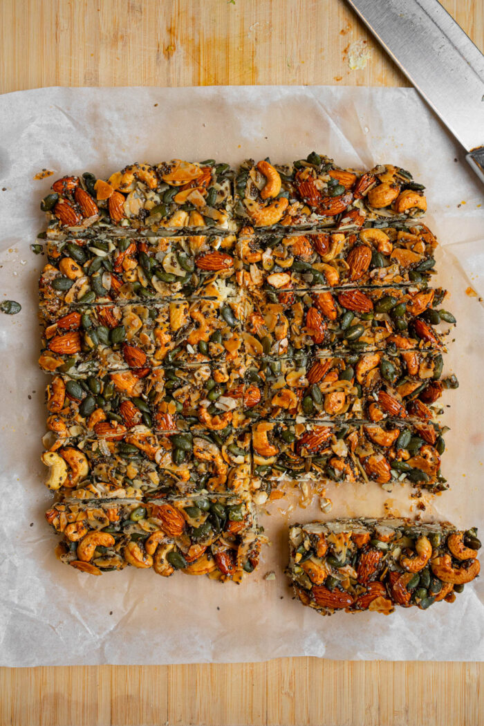 After cooling down, the nut and seed mixture is cut into bars.