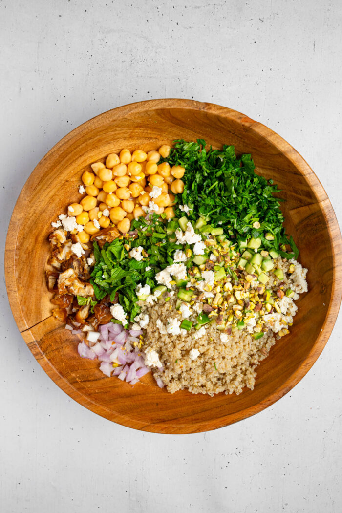 The chopped and prepared salad ingredients in a large salad bowl.