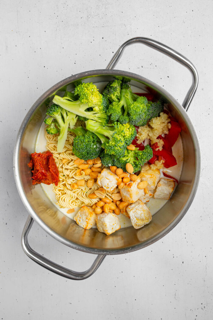 Coconut milk, Thai red curry and seasonings added to the noodles and veggies.