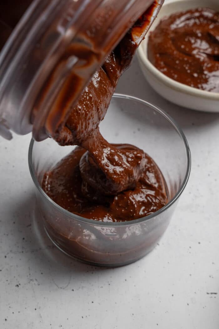 Pouring the rice chocolate pudding from the blender into a cup.