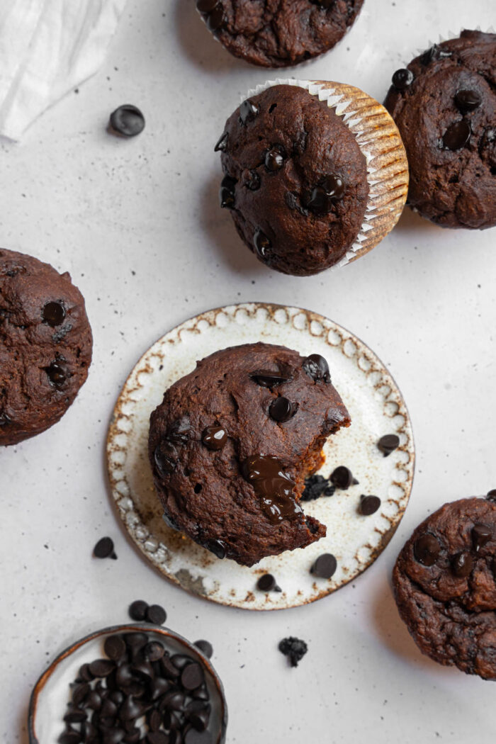 Hidden veggie muffin with a big bite taken out of it, shot from above.