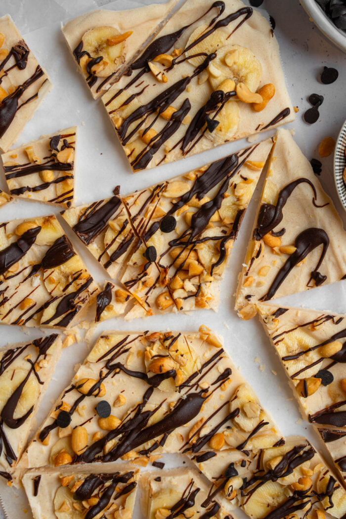 After freezing, the peanut butter yogurt bark is broken or cut into pieces.