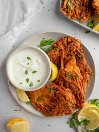 Top down view of vegan fried chicken served with vegan ranch.