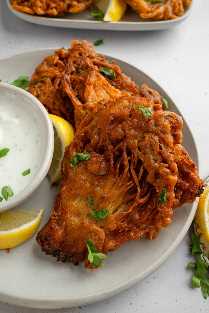 Vegan fried chicken served with vegan ranch and fresh herbs.