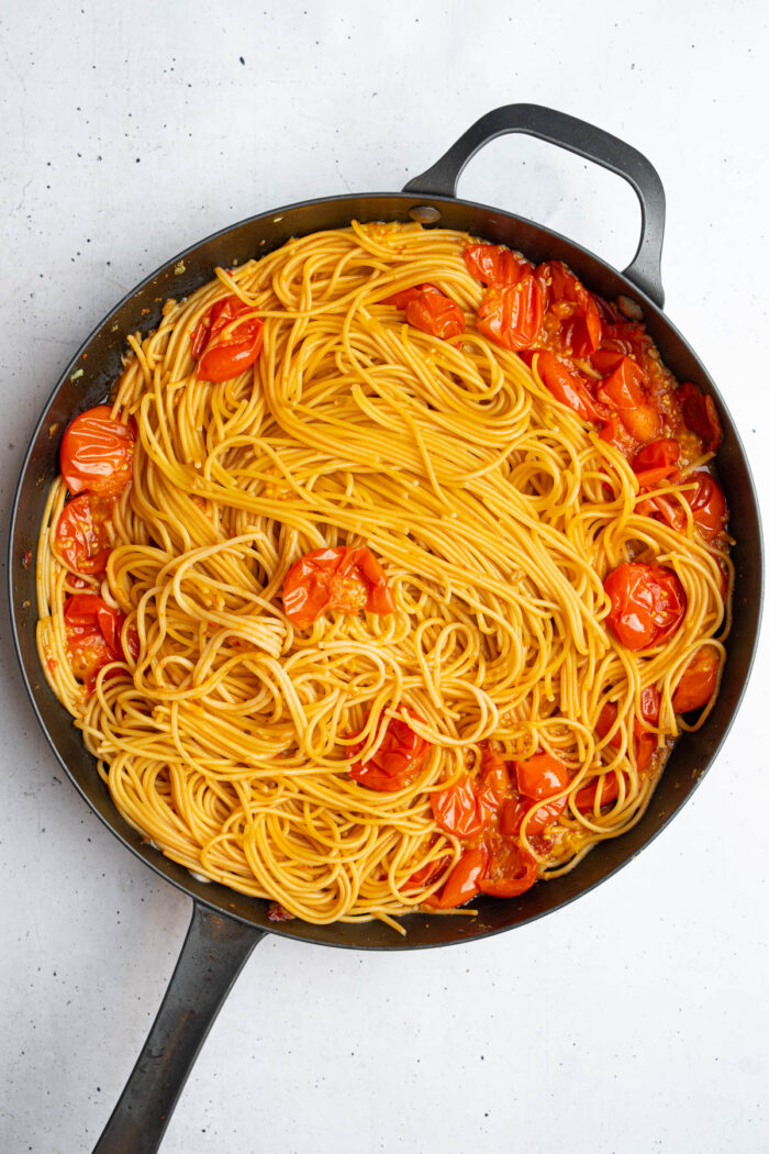 After cooking, pasta fills the skillet.