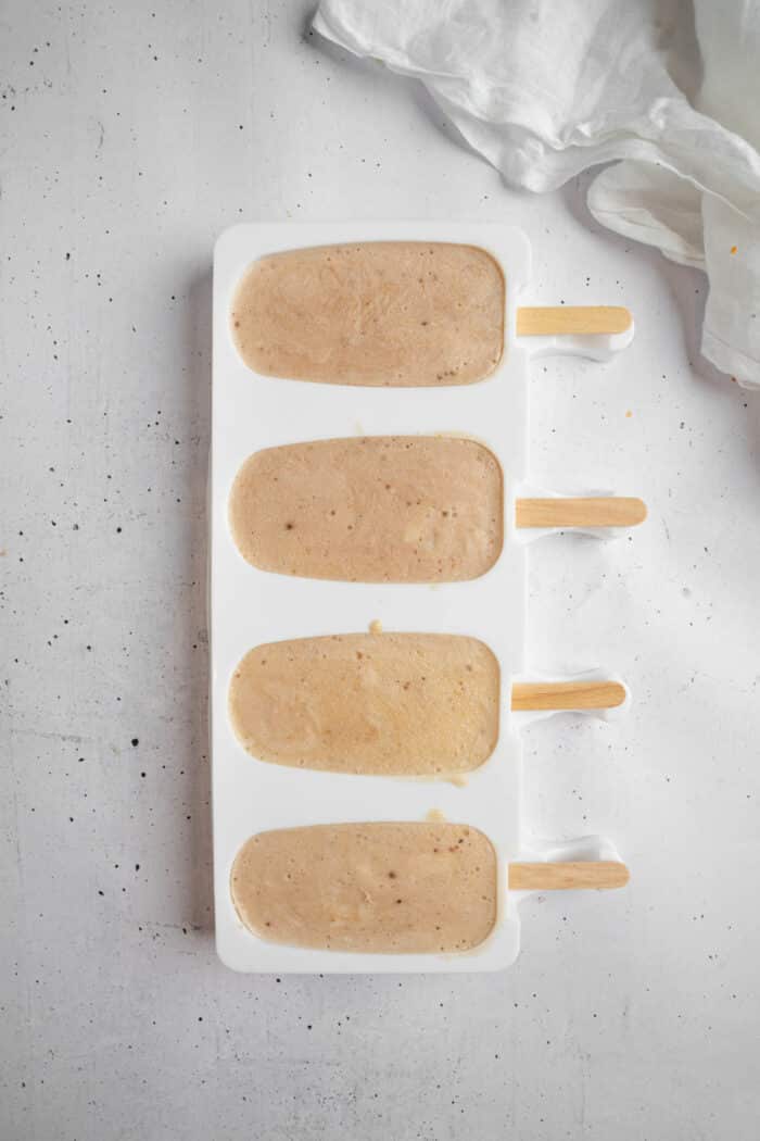 Ice cream mold with four vegan popsicles (vegan Magnums).