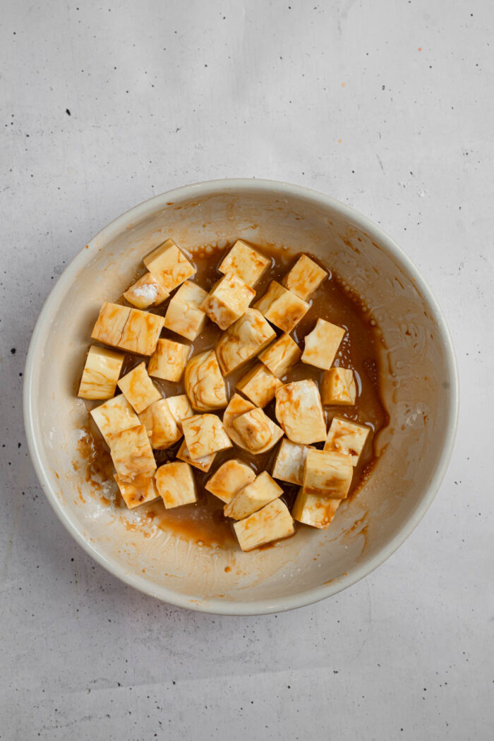 Tofu marinated in soy sauce, oil, and cornstach.