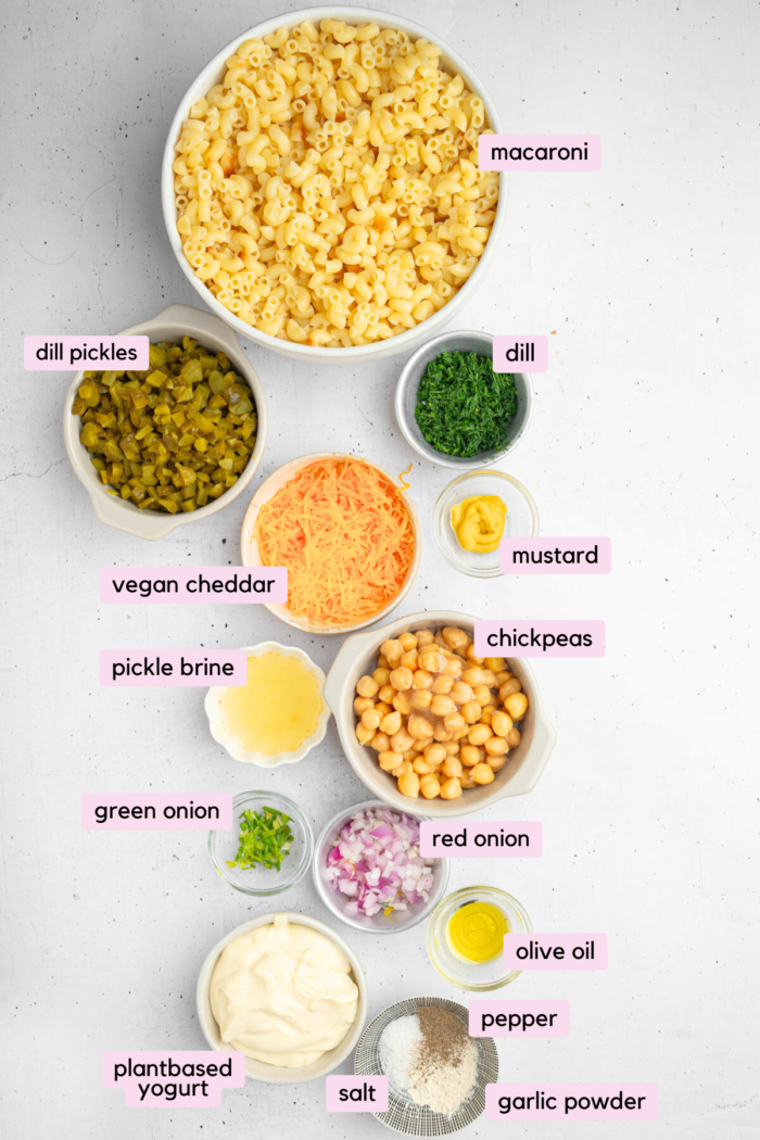 Ingredients for the dill pickle pasta salad laid out and labeled on a white background.