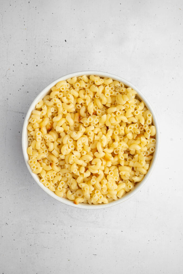 Cooked pasta in a white ceramic bowl.
