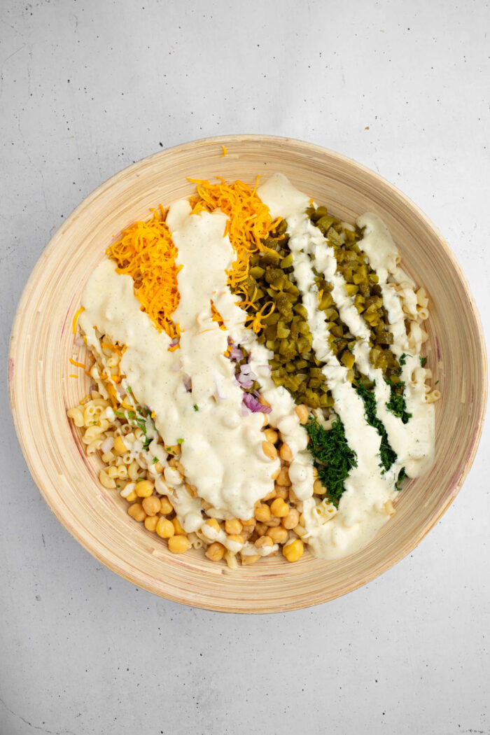 Creamy dressing drizzled over the top of the dill pickle pasta salad ingredients.