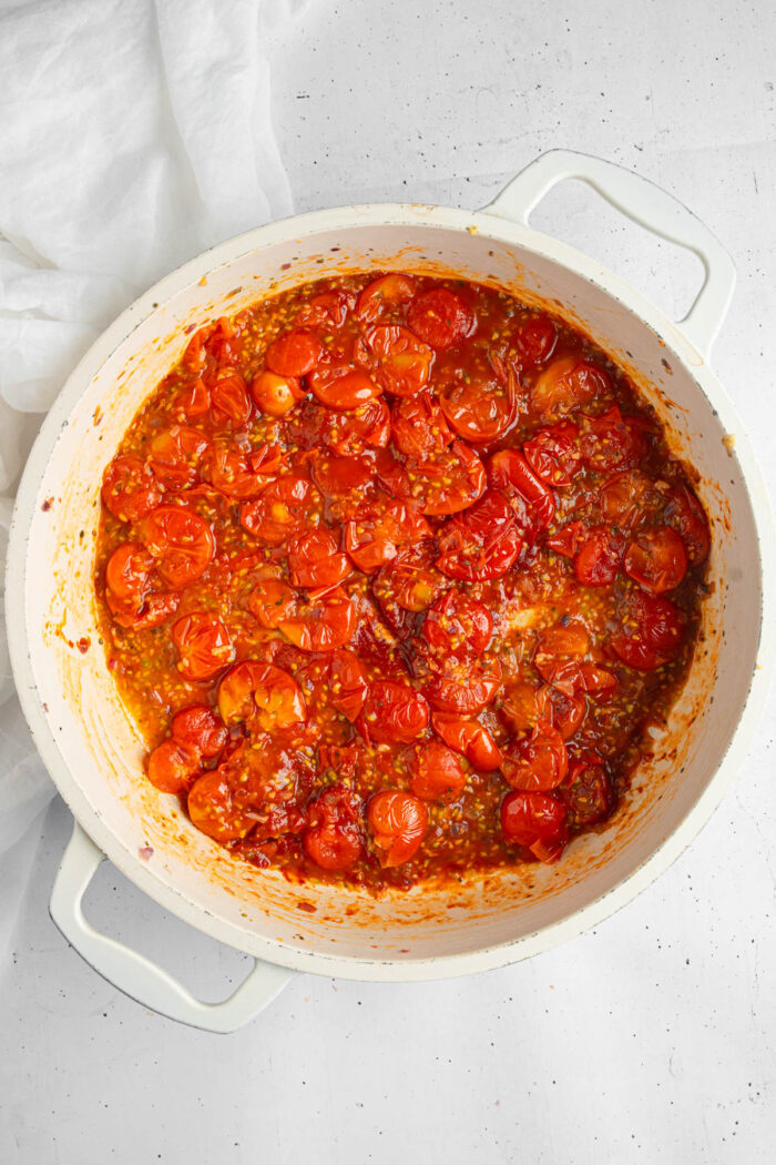 Cherry tomatoes cooked down and mixed with tomato paste.