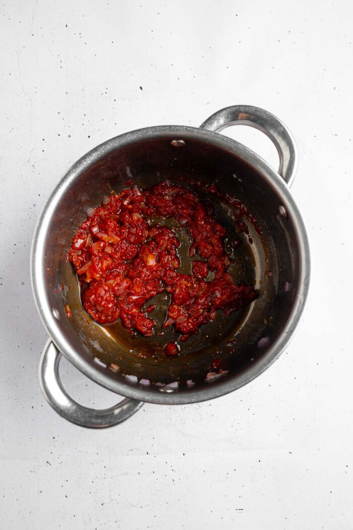 Tomato paste and herbs added to the base of the filling.