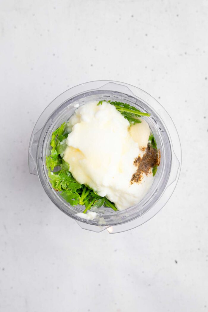 Cilantro lime dressing ingredients in a high-speed blender.