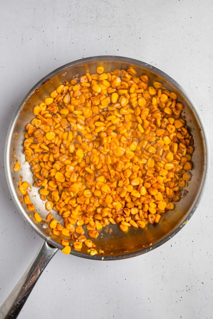 Corn browned in the pan with a few seasonings.