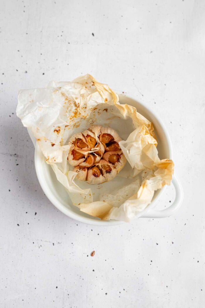 Whole roasted head of garlic.