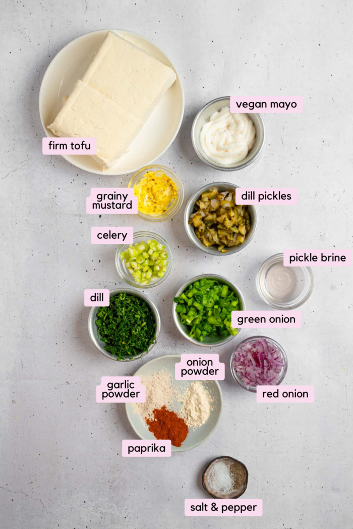 Ingredients for the vegan chicken salad recipe laid out and labeled on a light background.