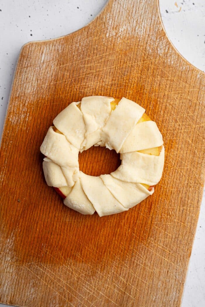 Puff pastry wrapped around the apple ring.