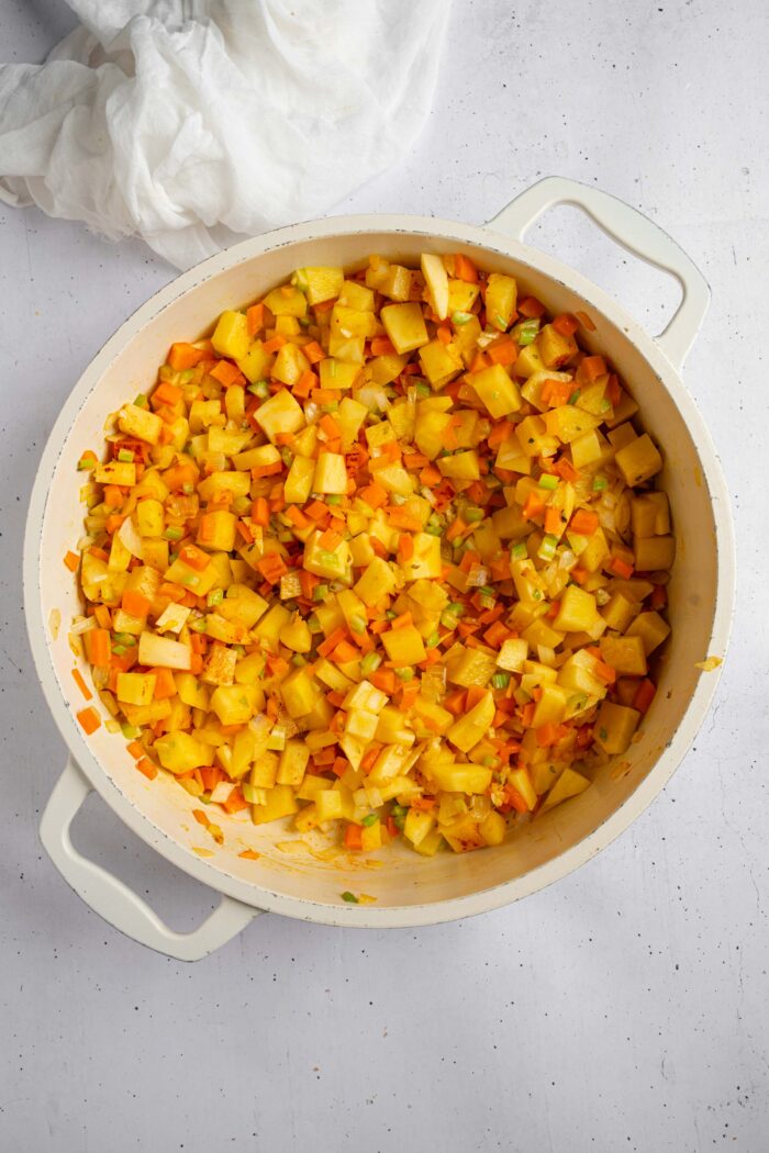 Potatoes and garlic added to the base, along with herbs.
