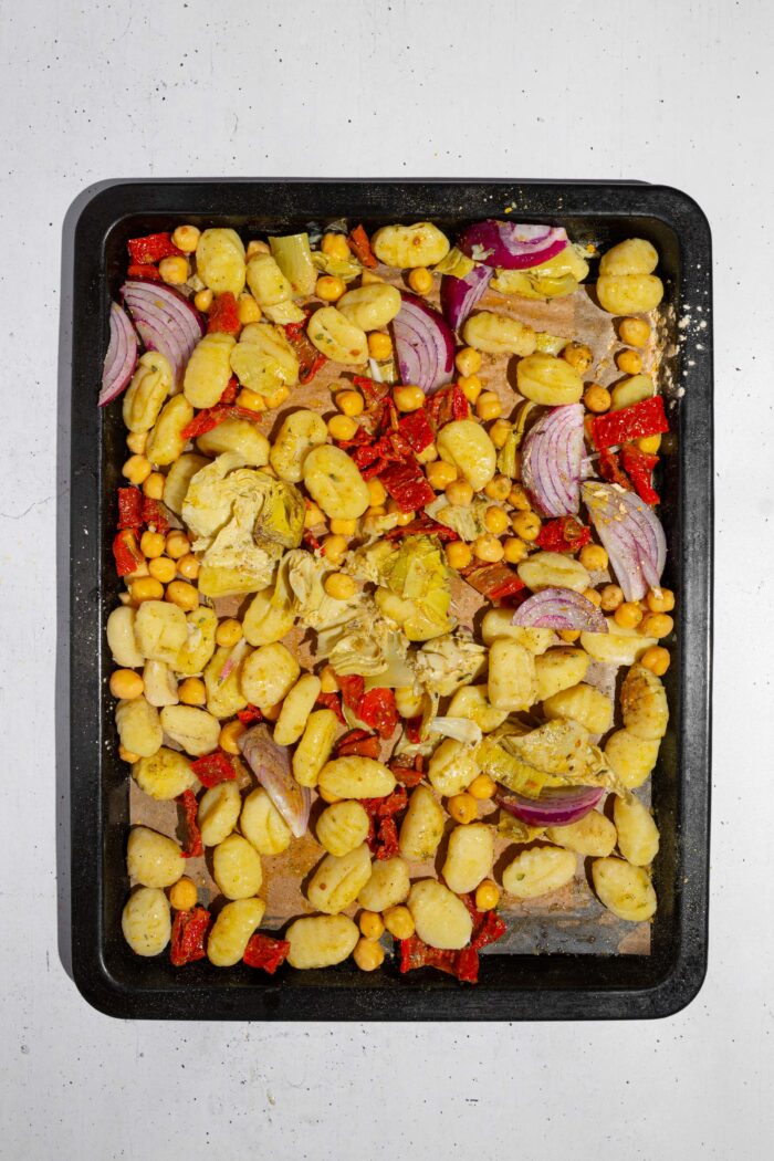 Gnocchi, chickpeas, and veggies mixed together with oil and seasonings.