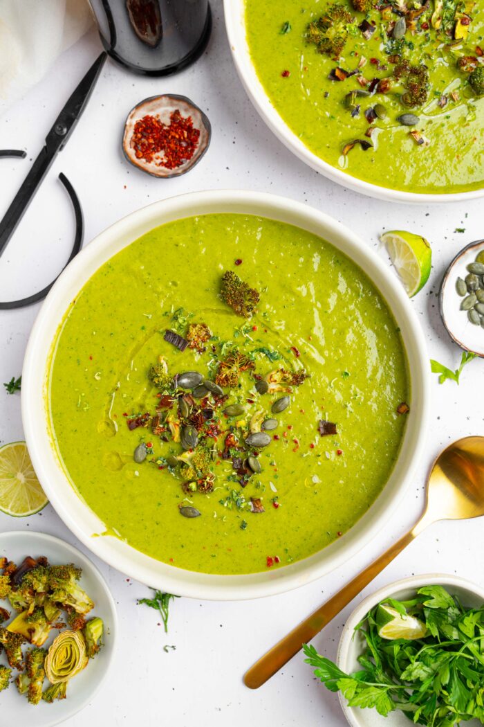 Title image displays a bowl of broccoli leek soup topped with spices and toasted pumpkin seeds.