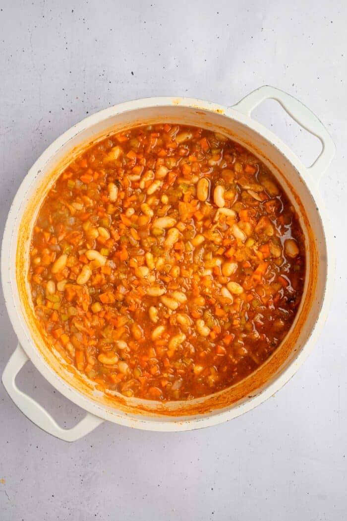 Tuscan white bean kale soup simmering in the pot.