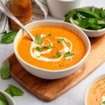 A serving of vegan high protein soup in a white ceramic bowl.