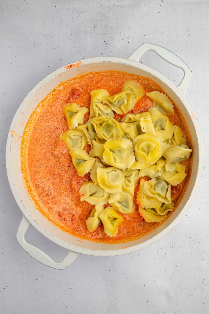 Tortellini added to the pan with the sauce.