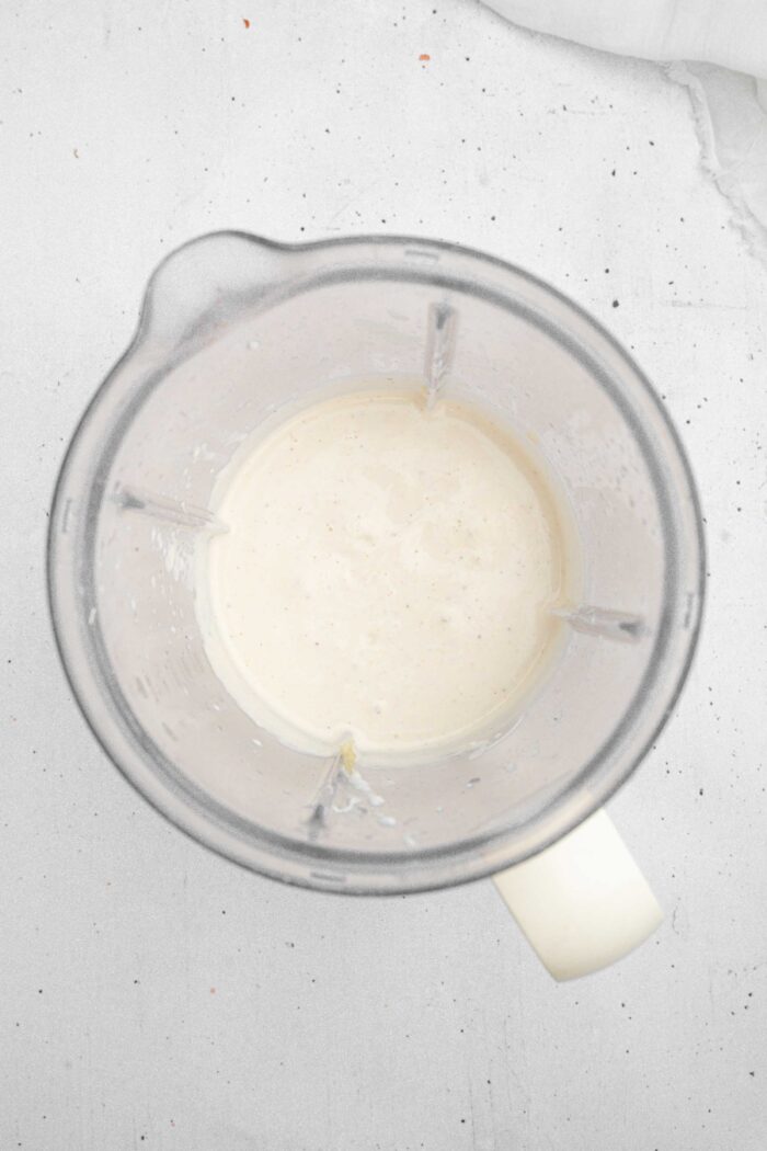 A blended creamy base for the caramelized onion dip.