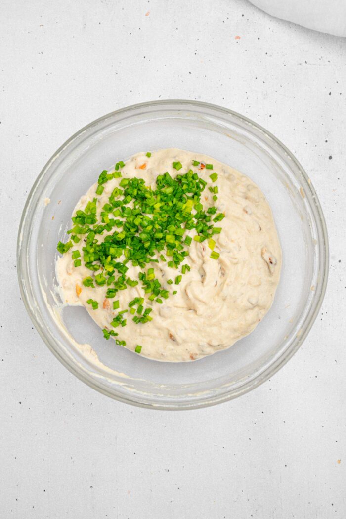 Chives added as the final step to make the caramelized onion dip.
