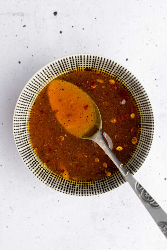 A maple and mustard glaze mised together in a bowl.