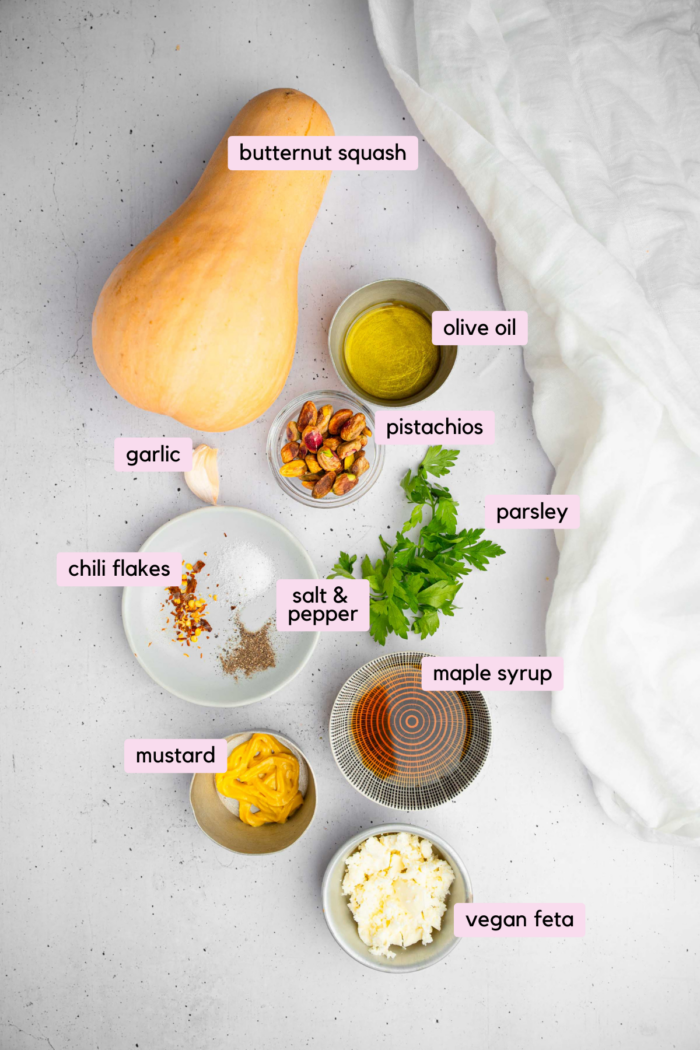 Ingredients to make hasselback butternut squash laid out and clearly labeled on a light background.