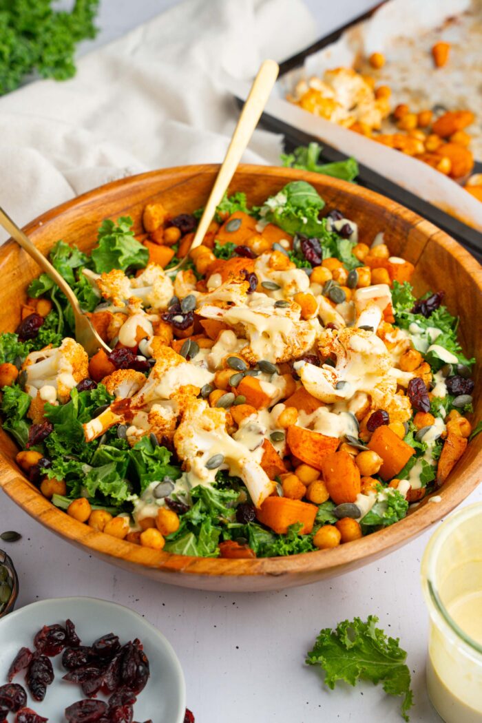 Dressing added on top of the winter kale salad, about to be mixed up in the bowl.
