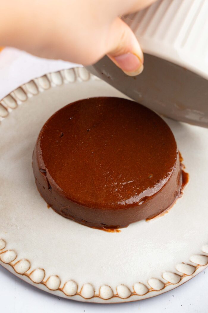 After chilling in the fridge, the persimmon pudding slides out f the ramekin.