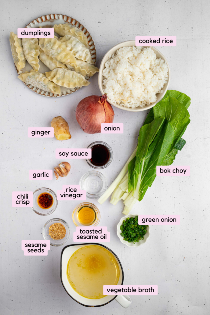 The ingredients for brothy rice with ginger and garlic laid out and clearly labeled on a light background.