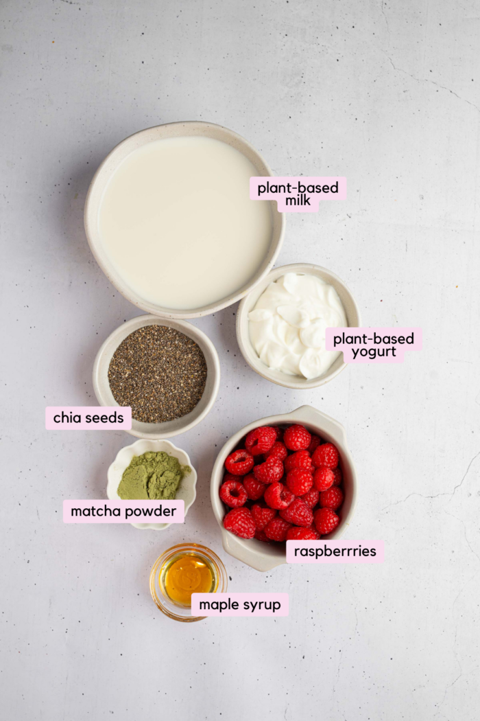 Matcha chia pudding ingredients laid out and labeled on a light clear background.