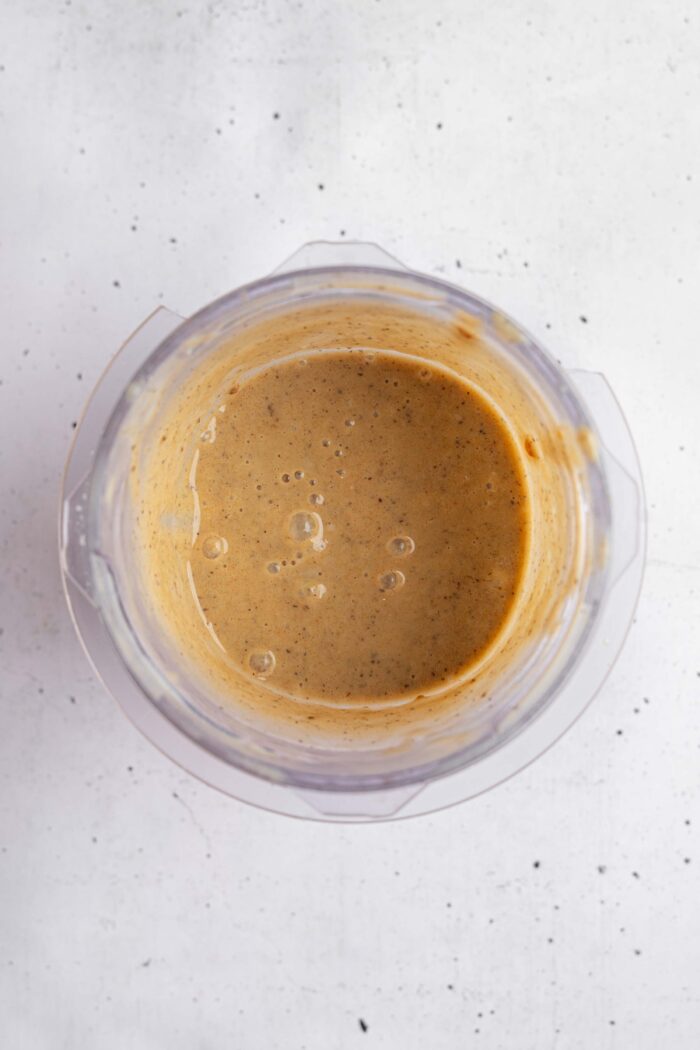 Soy milk blended with dates in a high-speed blender.