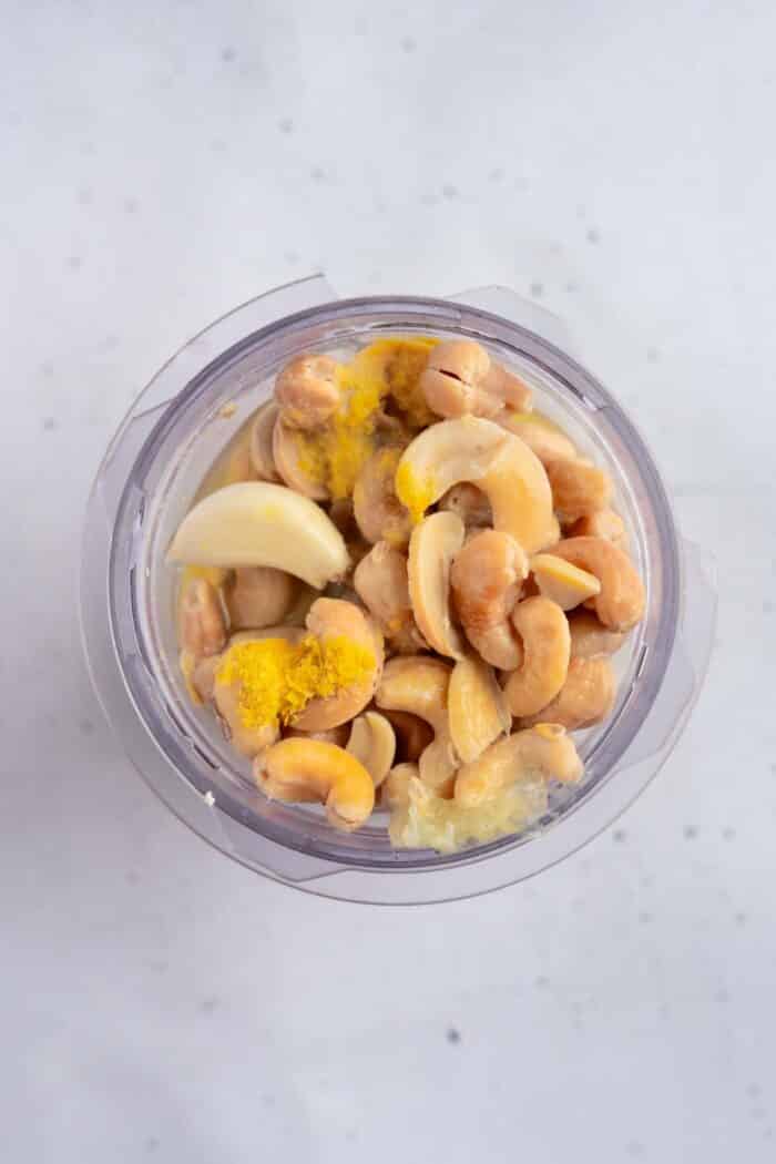 All of the ingredients for tofu cream put together in a high speed blender.