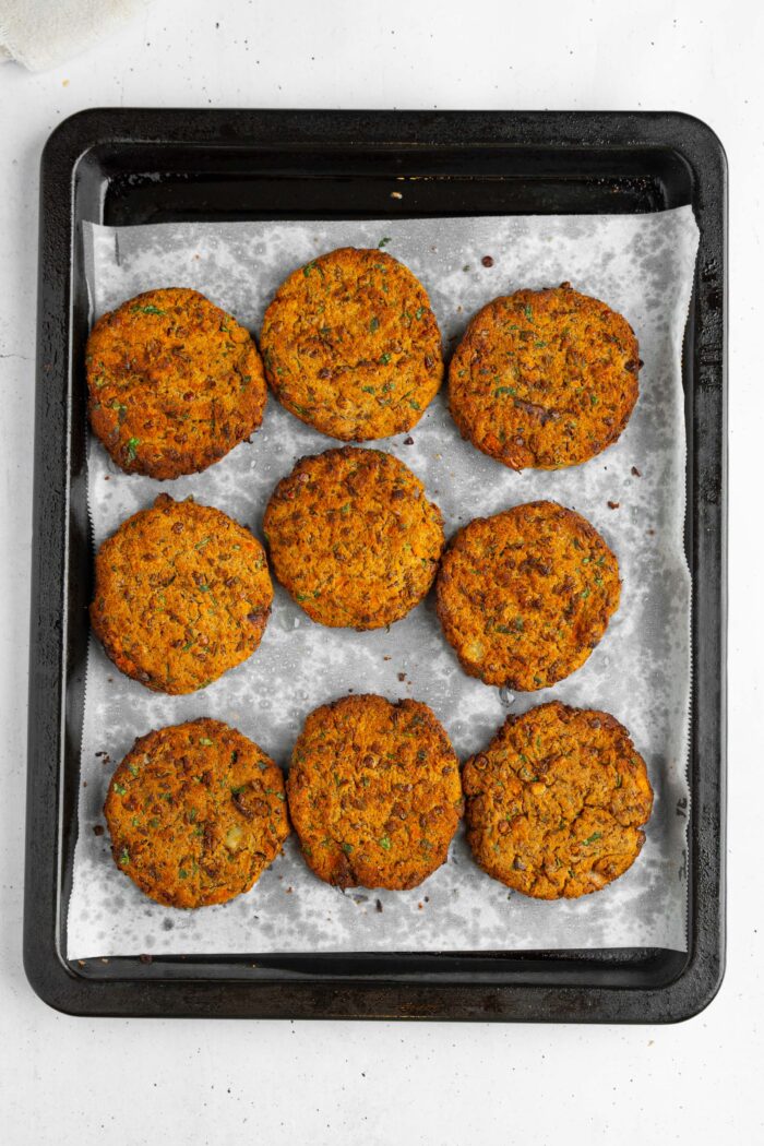 After cooking in the oven, the lentil patties are baked until browned and crispy.
