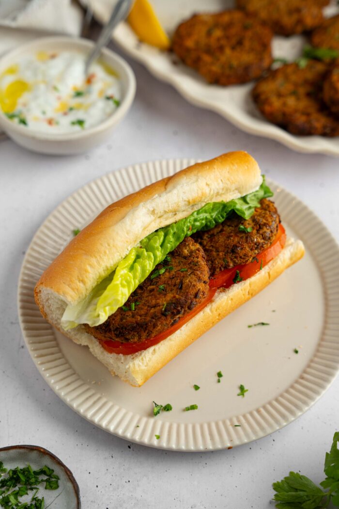 A baguette sandwich with the lentil patties as the filling.
