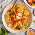 Title image depicts a bowl of ramen noodle bake served with crushed peanuts and cilantro.
