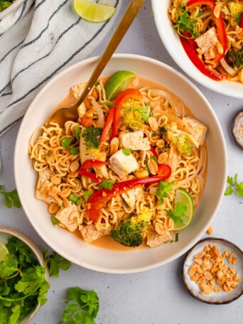 Title image depicts a bowl of ramen noodle bake served with crushed peanuts and cilantro.