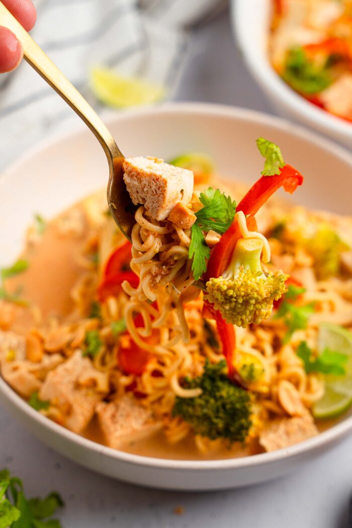 A fork lifting a little bit of everything from the ramen noodle bake serving.