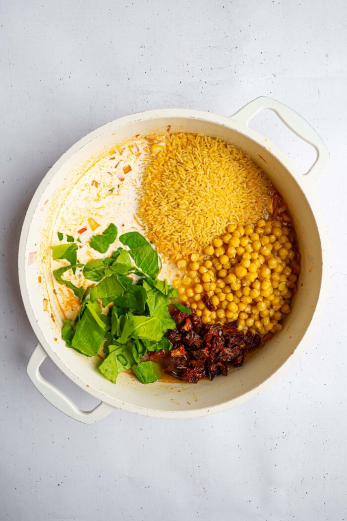 The ingredients for marry me orzo added to one pan.