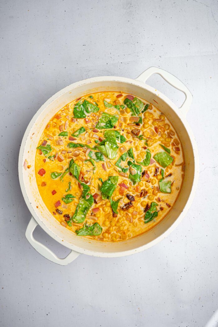 The pasta is mixed with veggies and chickpeas to make marry me orzo in one pan.