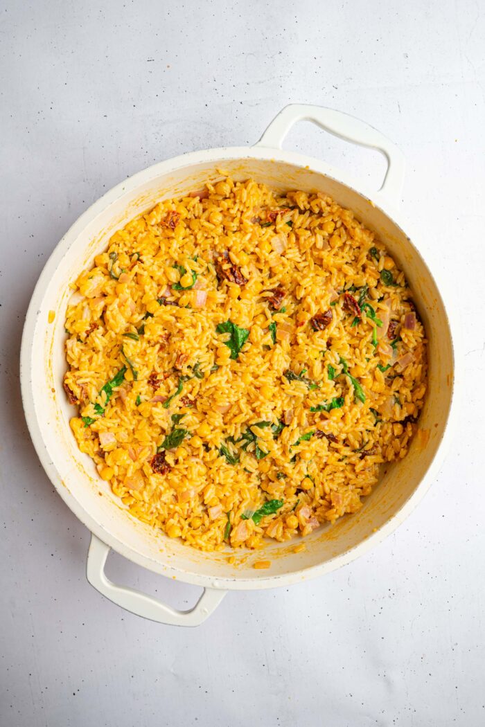 Fully cooked marry me orzo in a shallow large pan.